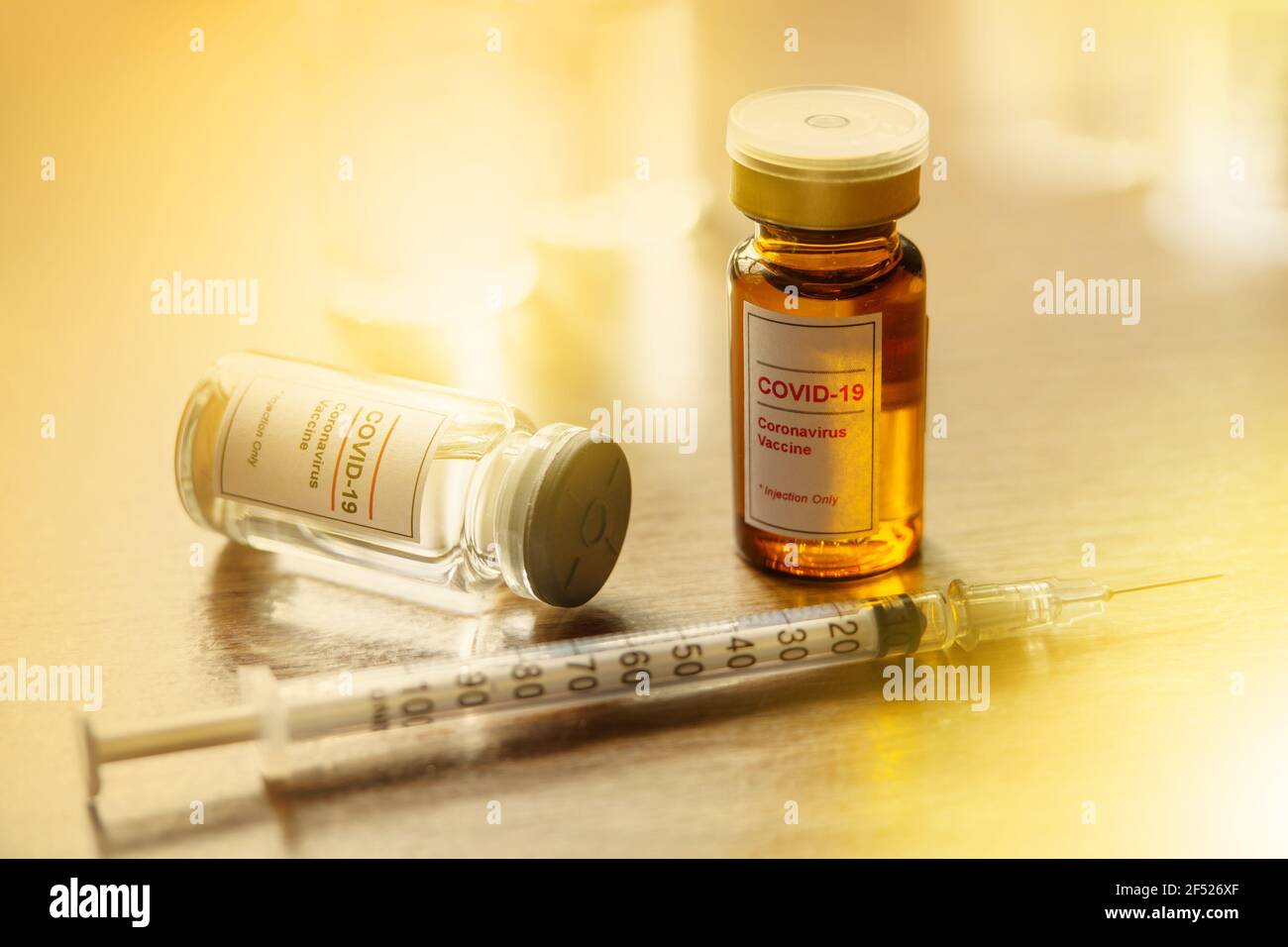 Coronavirus, COVID-19 Vaccine Vials and Syringe on doctor table Stock ...