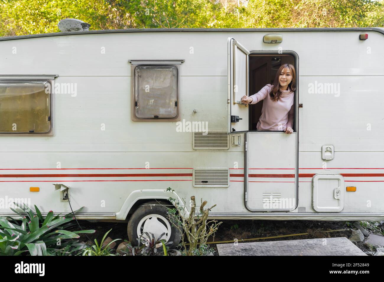 happy young woman at window of a camper RV van motorhome Stock Photo ...
