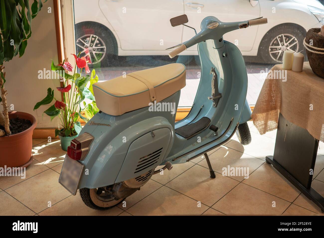Italian scooter, used as a piece of furniture in a shop of a baker in Italy  Stock Photo - Alamy