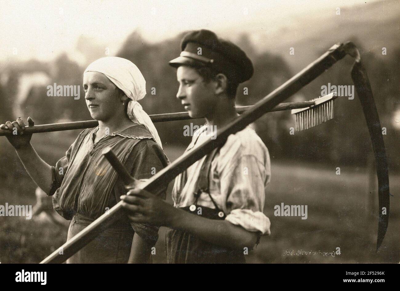 Erzgebirge (area around Steinbach). Farm Woman with rake and boy with
