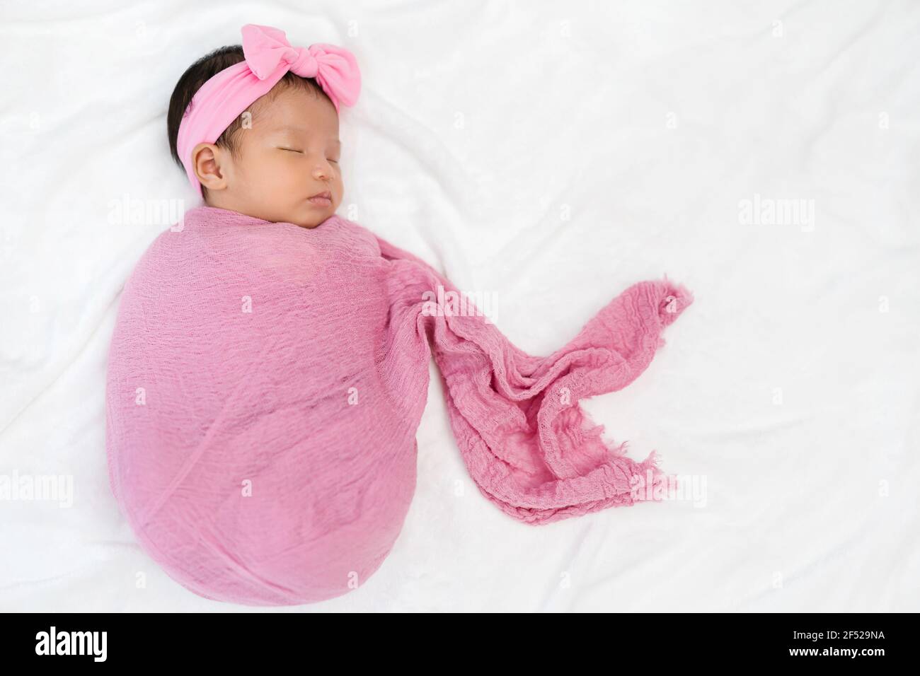 Cute little baby girl wrapped hires stock photography and images Alamy