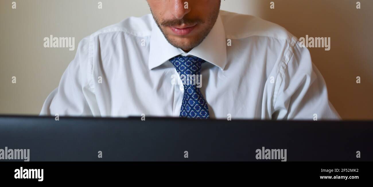 Focused Caucasian businessman working on his laptop Stock Photo