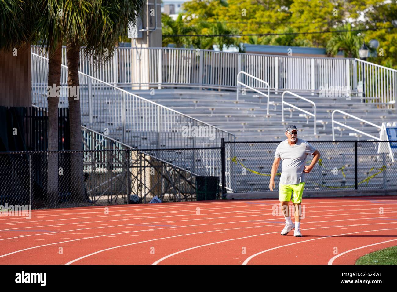 Senior man running beach hi-res stock photography and images - Alamy