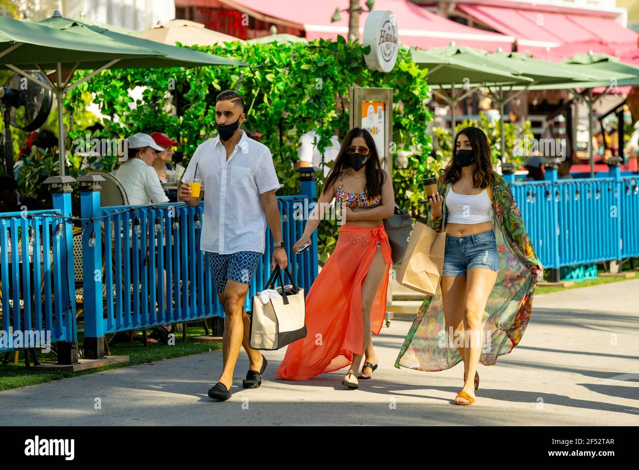 Spring breakers in Miami Beach FL walking on Ocean Drive Stock Photo
