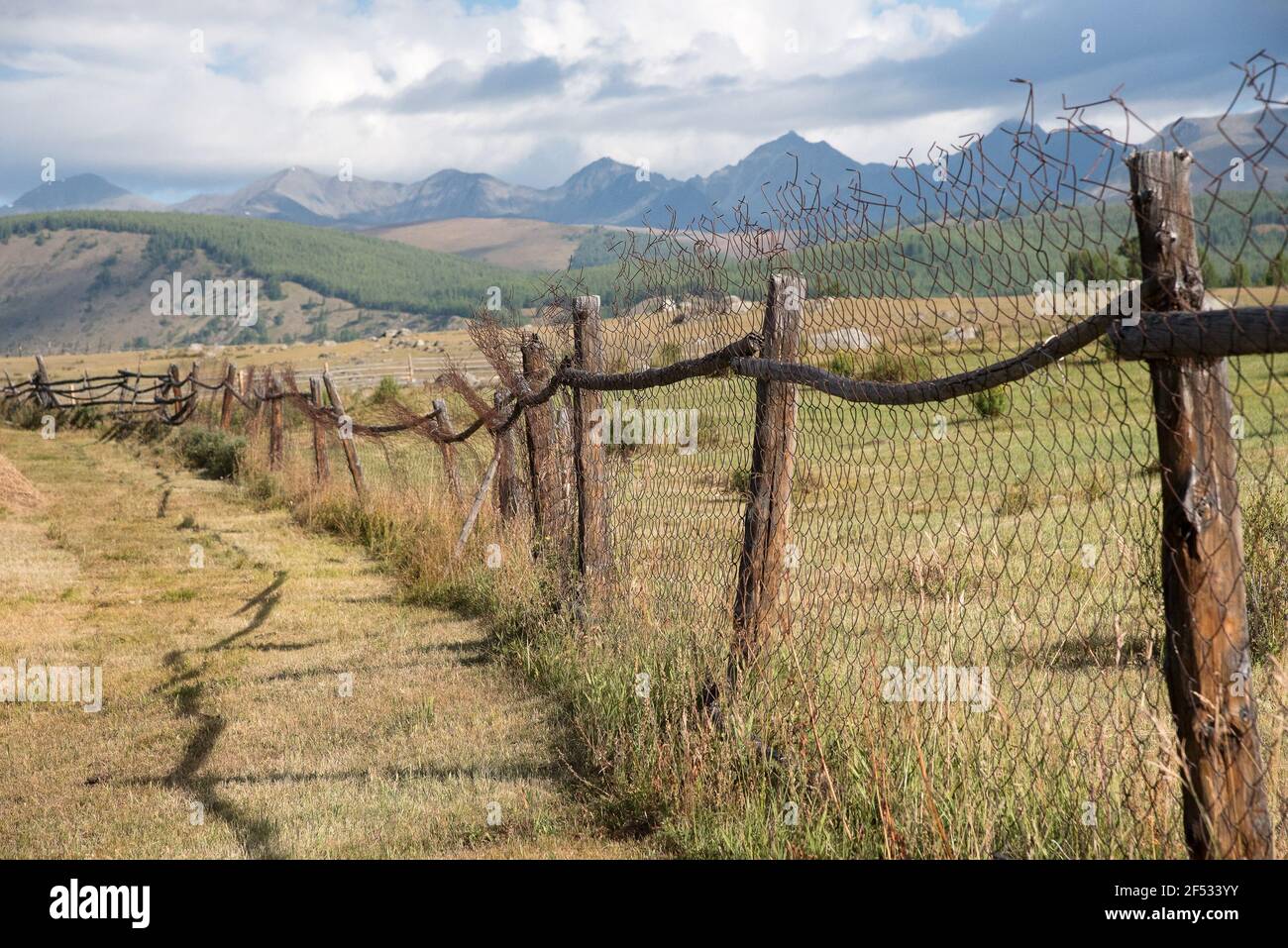 Wooden fence in the highlands and blue sky with clouds Stock Photo - Alamy