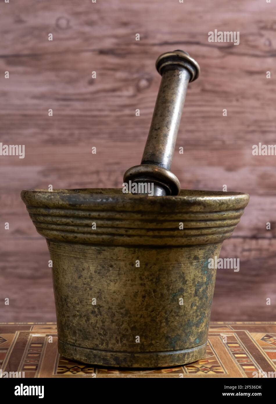 Metal Mortar for pounding weeds in pharmaceutical labors. Stock Photo