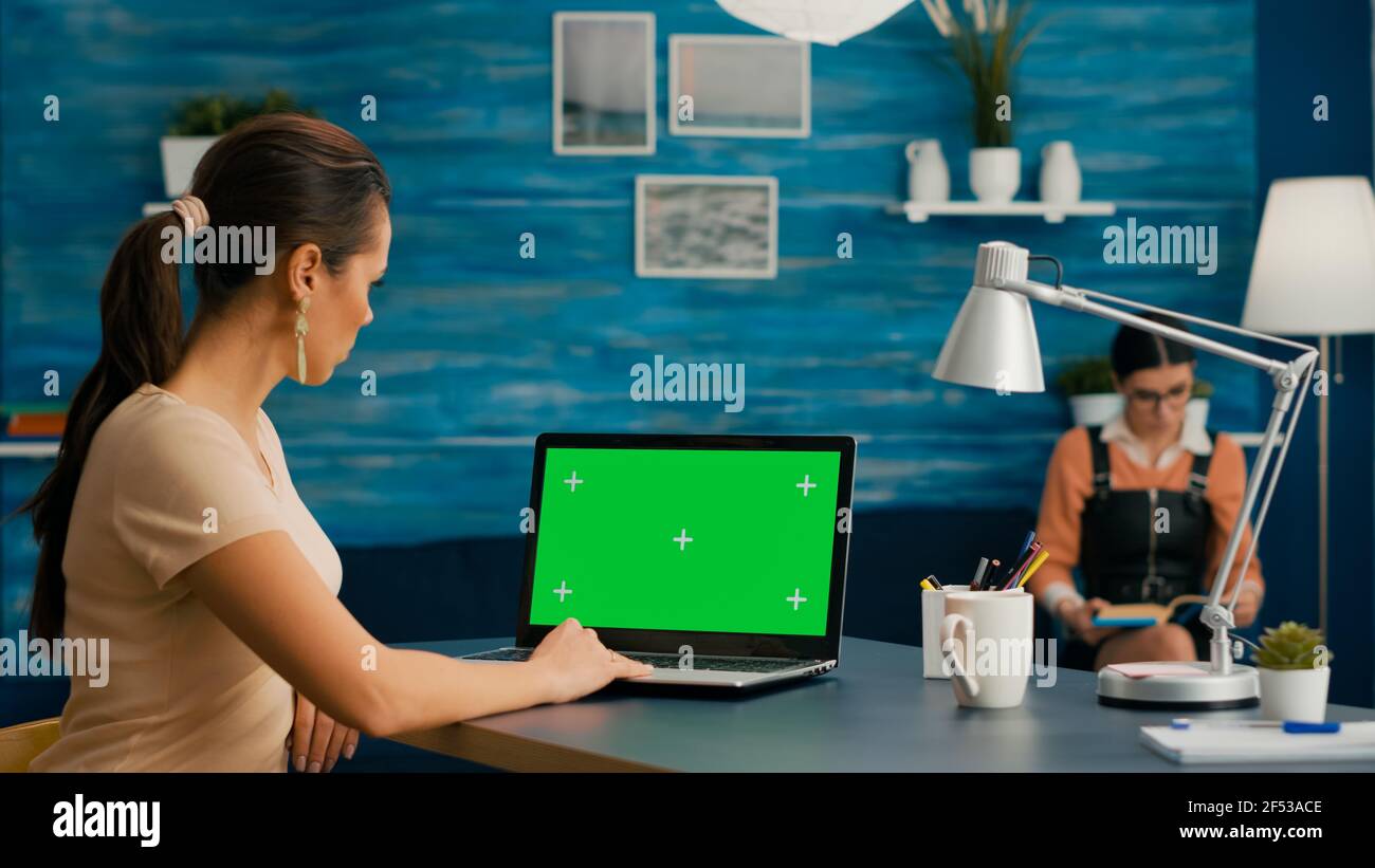 Freelancer using computer with mock up green screen chroma key for ...