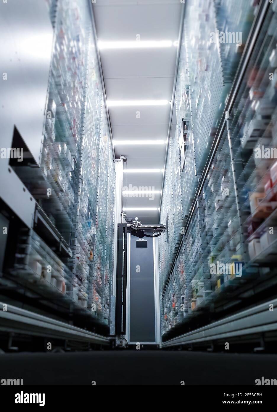 Modern pharmacy storage room and  robot hand s are arranging and storing out drugs in a pharmacy Stock Photo