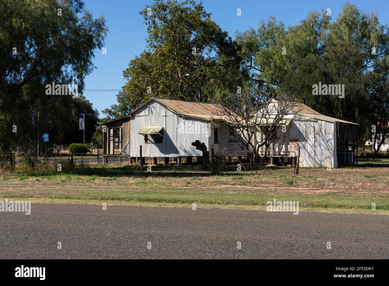 Typical old house in the country in outback Western Queensland made of corrugated iron and weatherboard and raised from the ground on wooden stumps ne Stock Photo