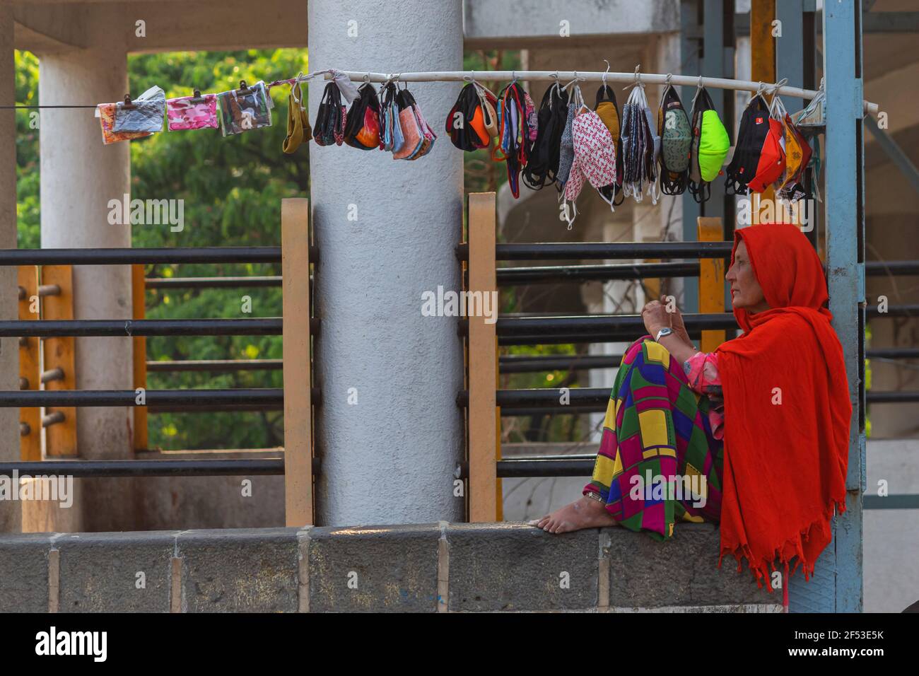 Woman selling masks on street, Pune, Maharashtra, India. Stock Photo