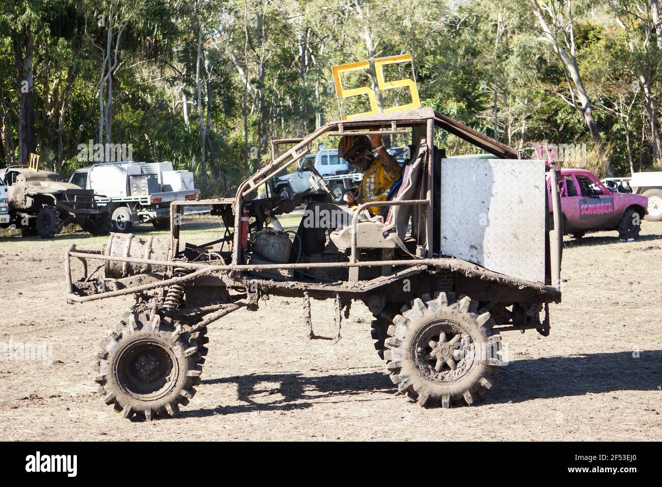 A home made mud racing vehicle splattered in mud after a race around the circuit in Queensland, Australia. Stock Photo