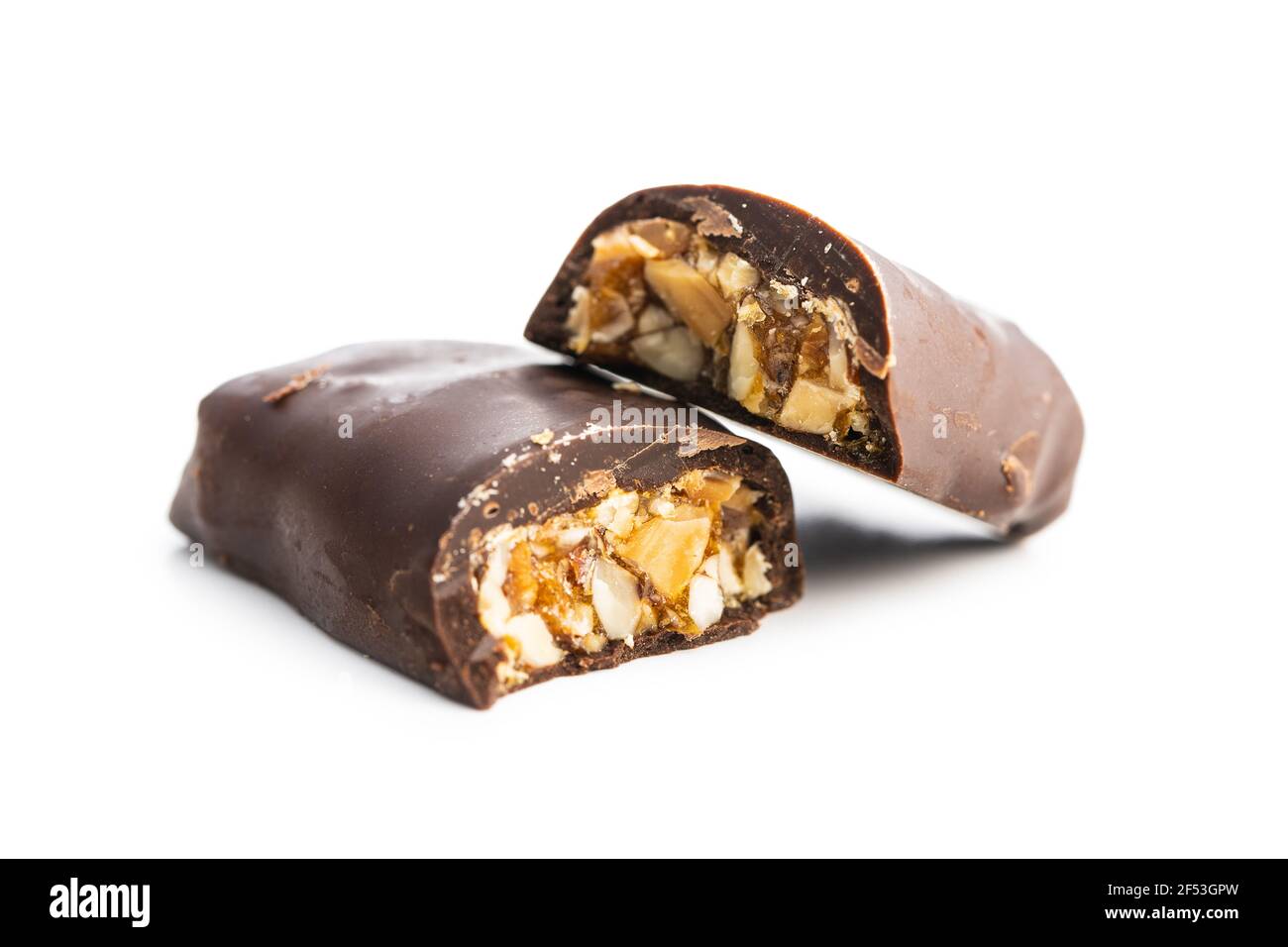 Chocolate bars with nuts filling isolated on white background. Stock Photo