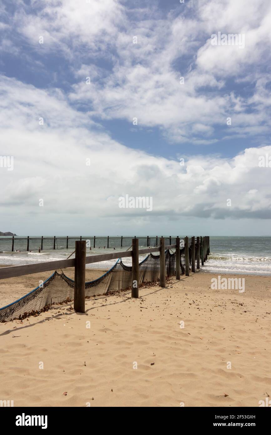 A beach swimming enclosure with netting to protect people from sharks, jellyfish and stingers. Stock Photo