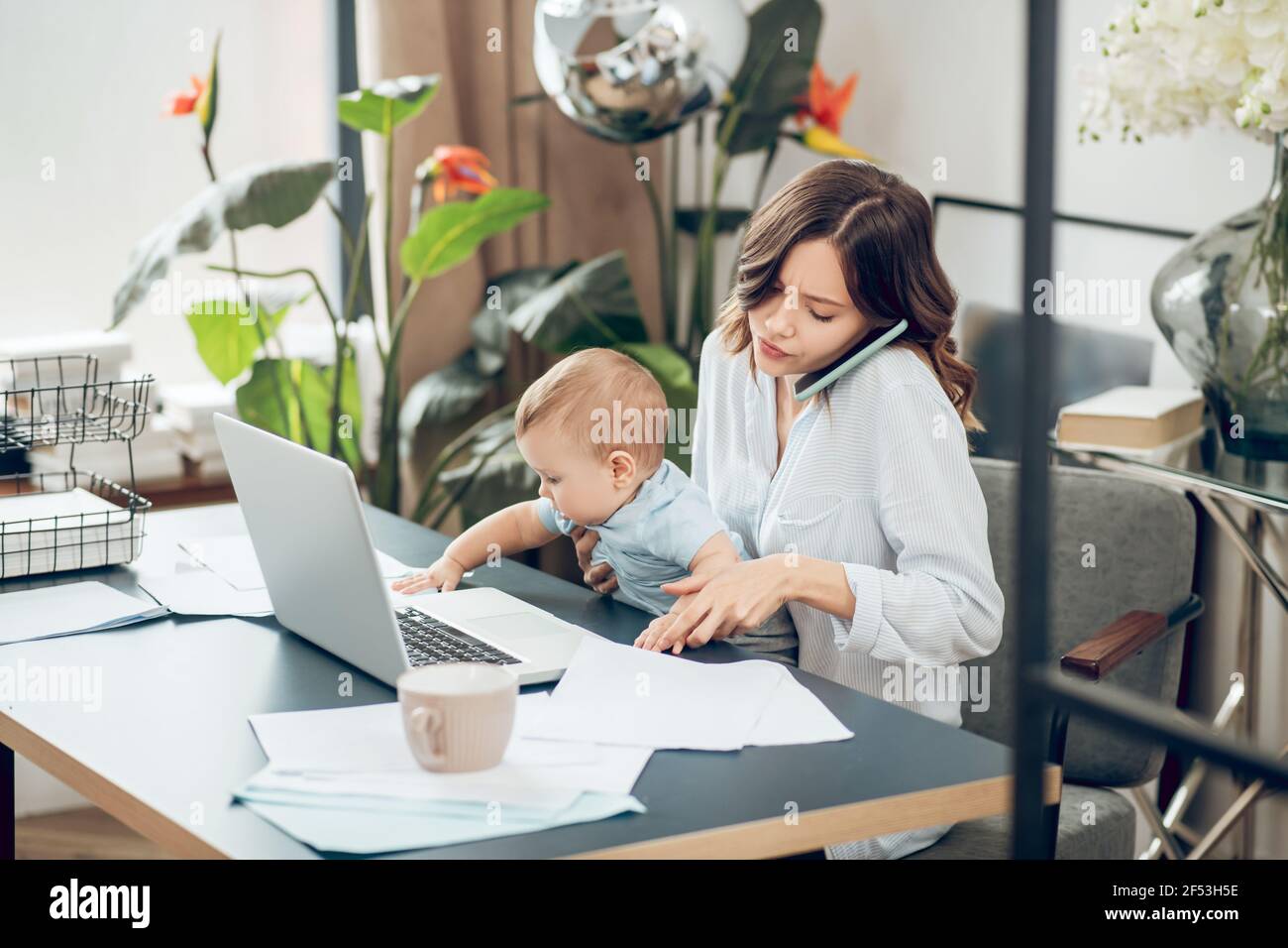 Active little child and mom working from home Stock Photo Alamy