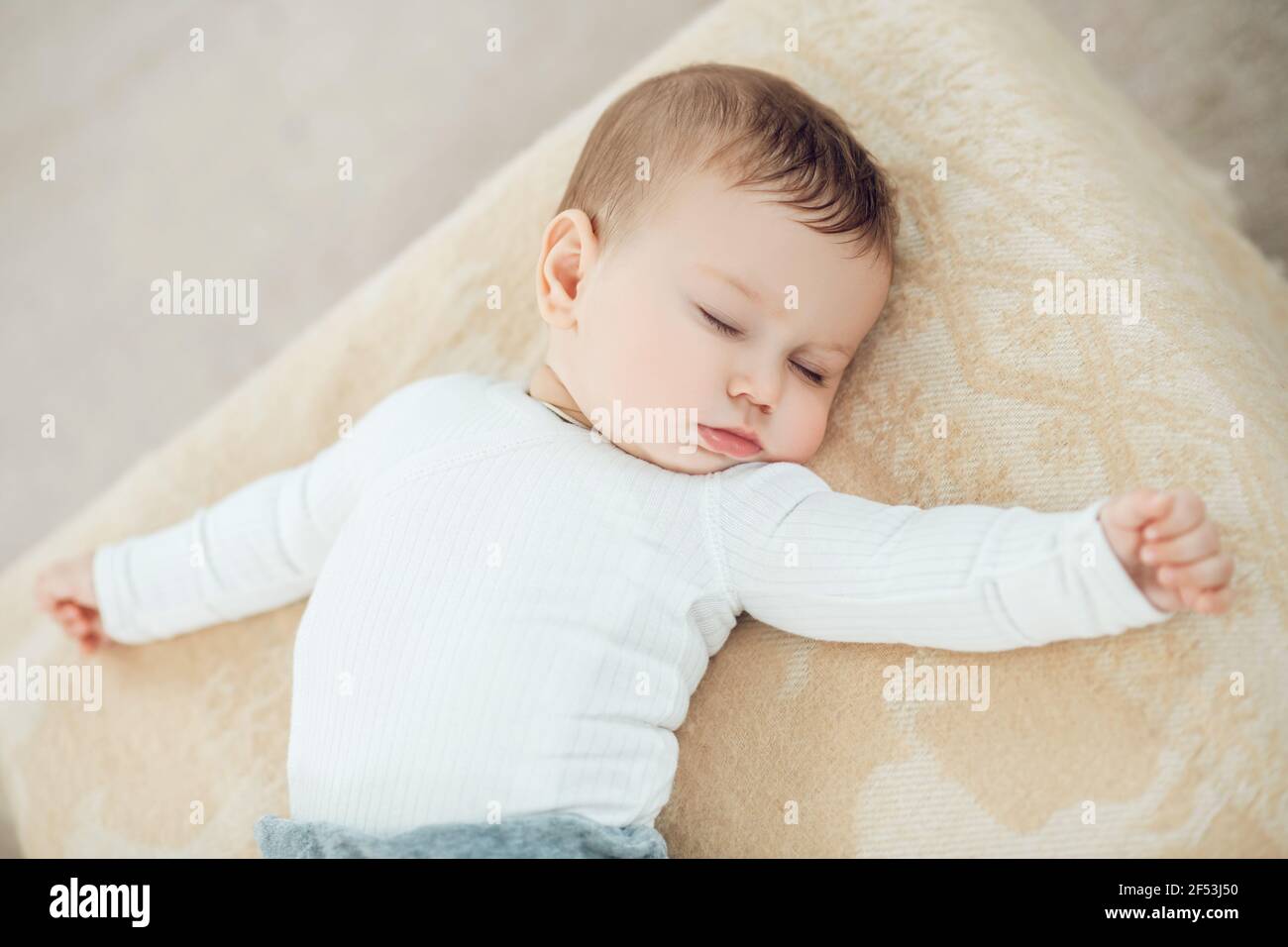 Sleeping cute baby with arms outstretched Stock Photo Alamy