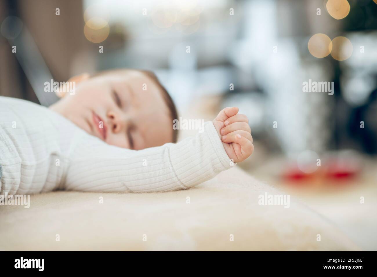Fingers clenched into fist on hand of sleeping baby Stock Photo Alamy
