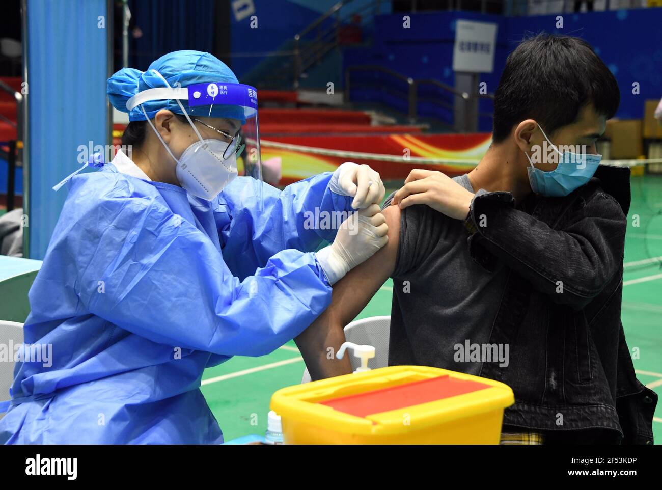 Beijing, China. 24th Mar, 2021. A student receives the second dose of COVID-19 vaccine at the Beihang University in Beijing, capital of China, March 24, 2021. Credit: Ren Chao/Xinhua/Alamy Live News Stock Photo