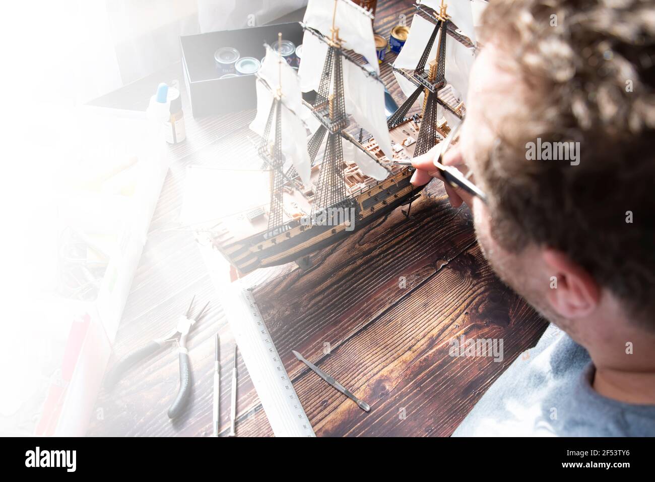 Model Ship Building handcraft on table with different materials Stock Photo