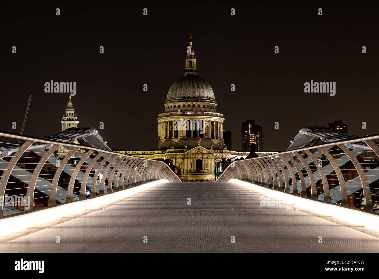 St Pauls Cathedral, London taken from the Millennium Bridge at night time with nobody around Stock Photo