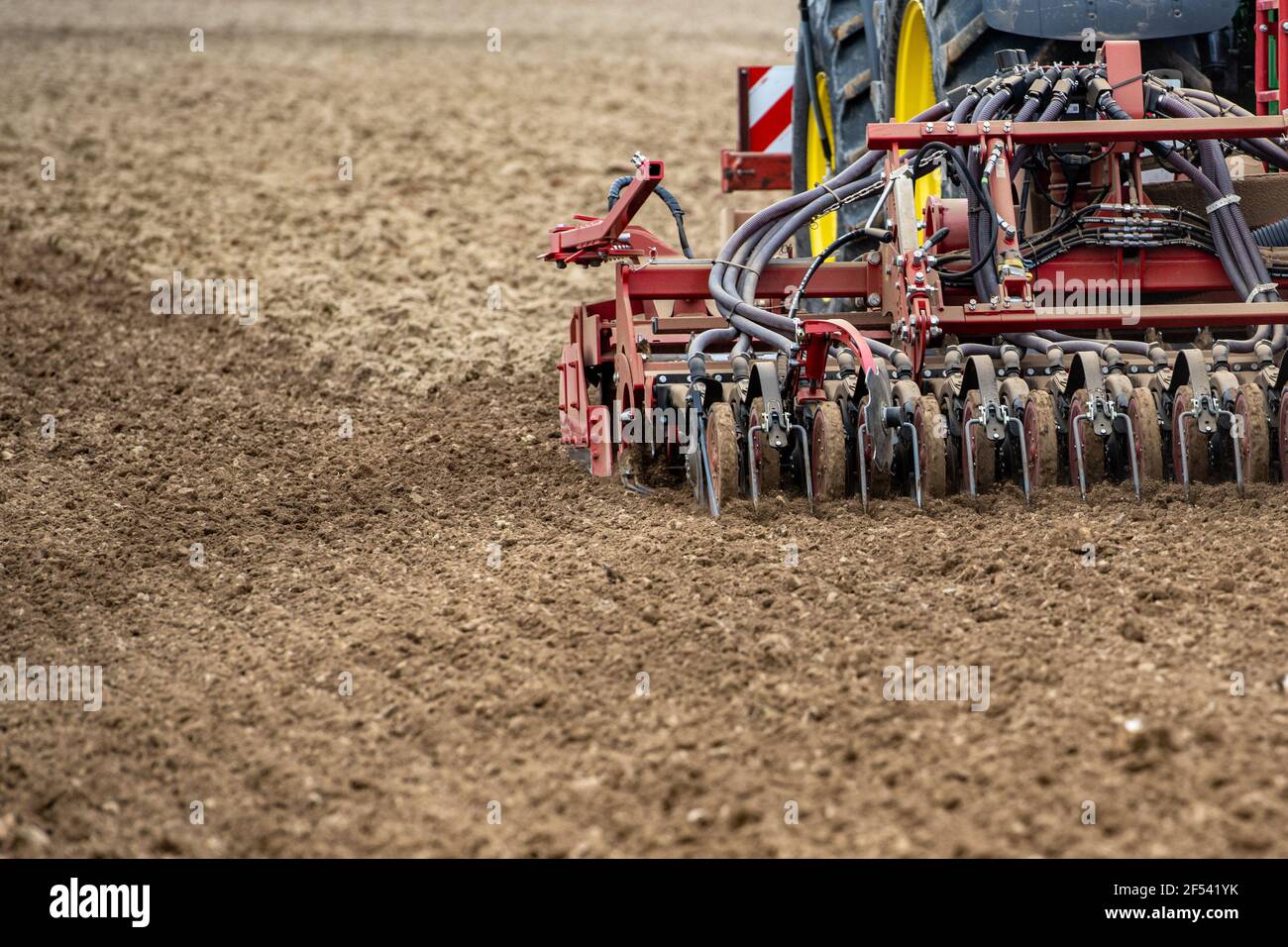 Feldkirchen, Germany. 24th Mar, 2021. Seeds of malting barley are grown in a field with a drill. Credit: Armin Weigel/dpa/Alamy Live News Stock Photo