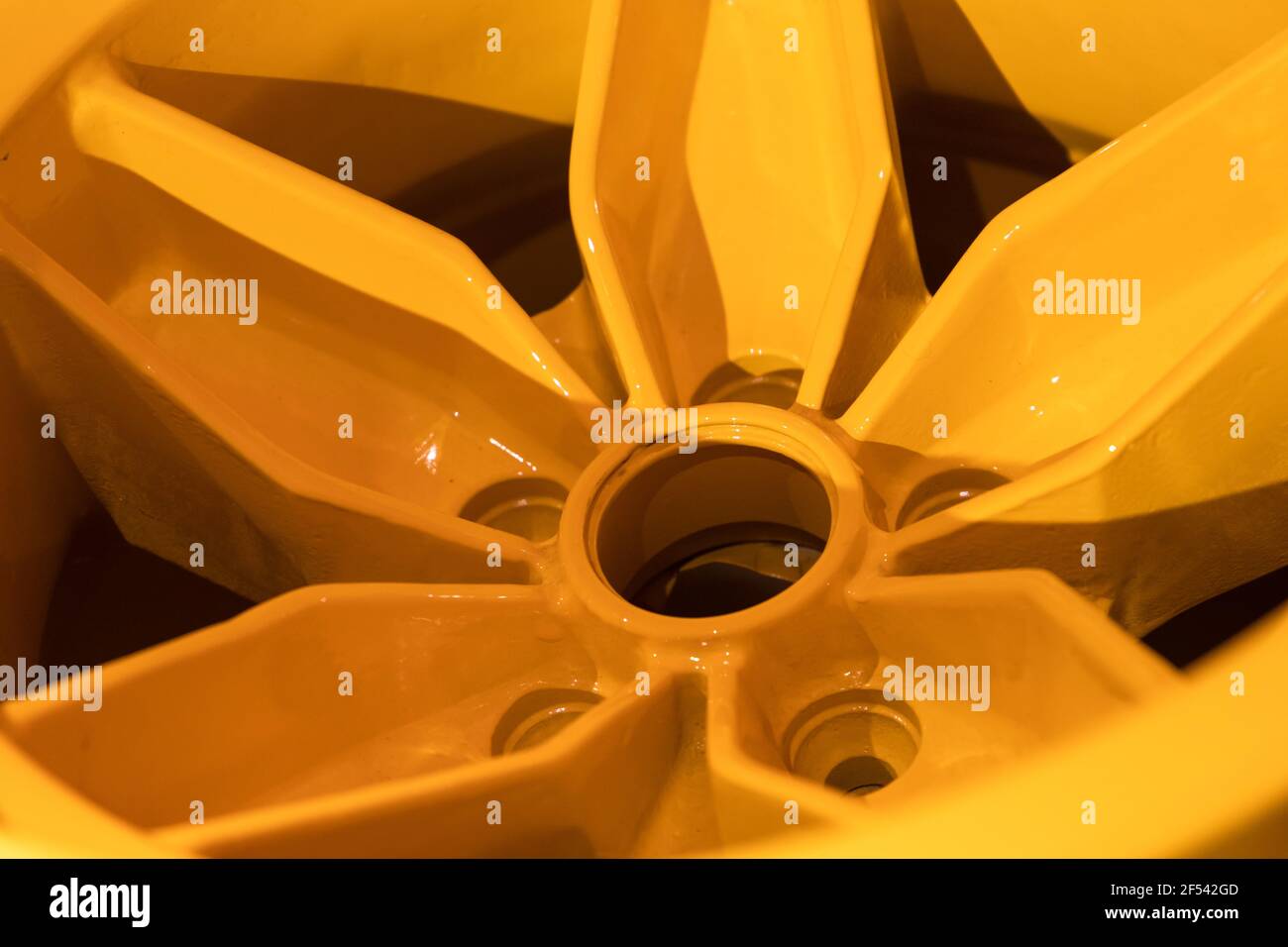 Yellow Square Rim Forged yellow sports car rim, close up photo. Abstract modern car ...