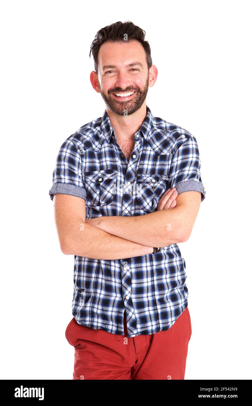Portrait of stylish mature man standing with arms crossed and smiling ...