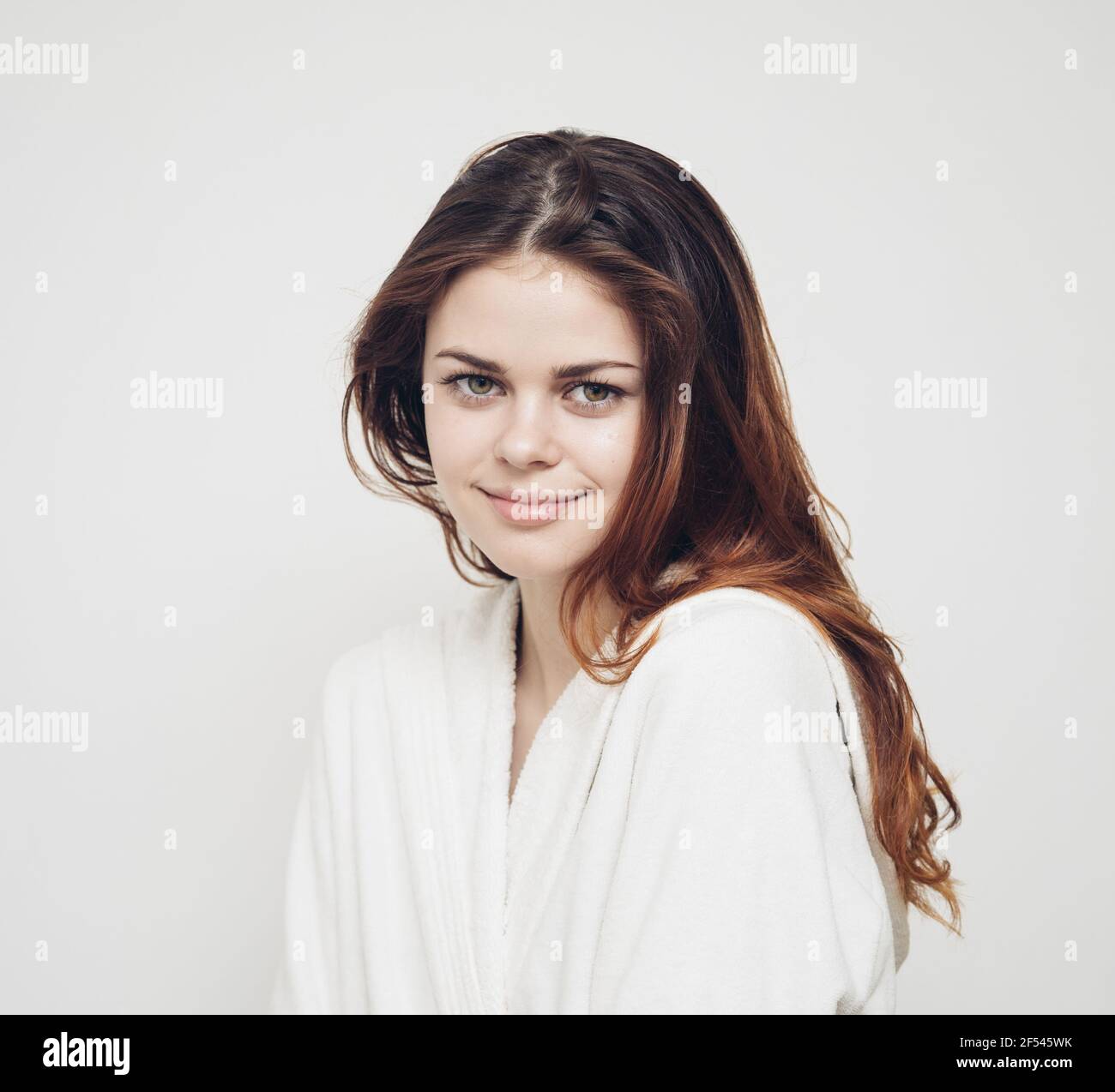 woman combing hair brittle ends split ends health problems Stock Photo