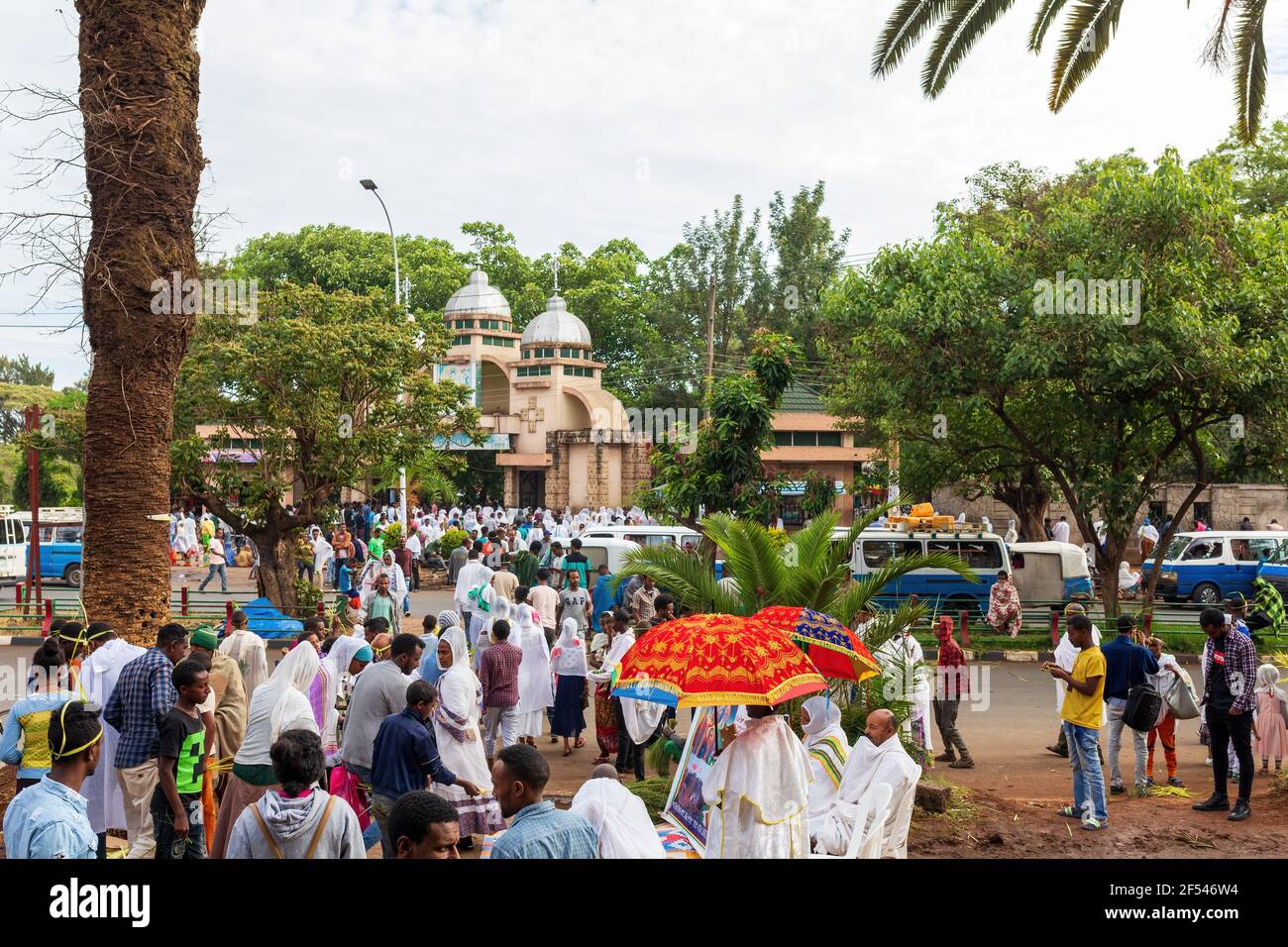 Azezo, Amhara Region, Ethiopia - April 21, 2019: Orthodox Christian people white dressed walk to mass on the street during easter holiday. Bahir Dar, Stock Photo