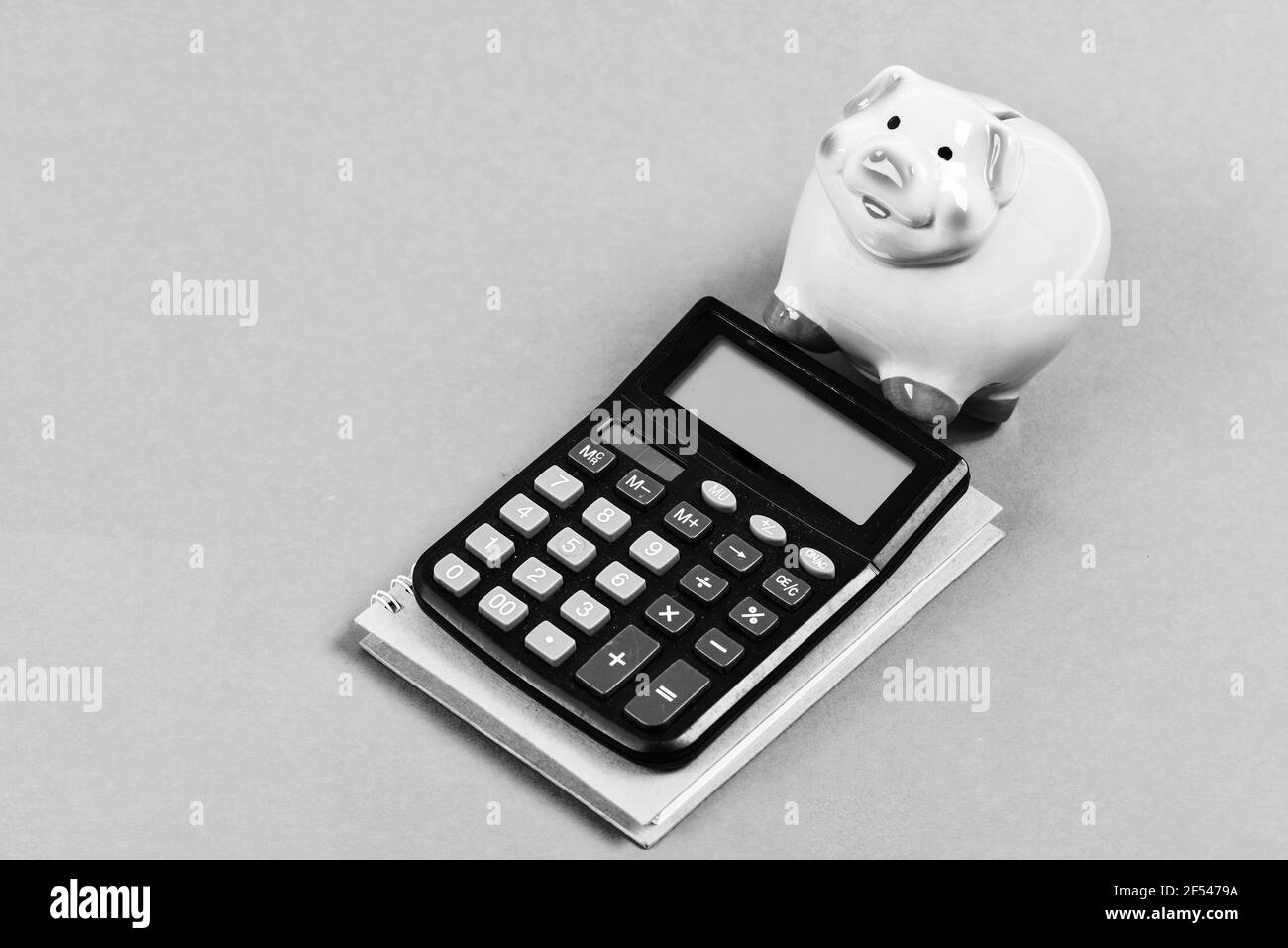 Piggy bank pink pig and calculator. Business administration. Finance manager job position. Trading exchange. Trade market. Finance control. Credit Stock Photo