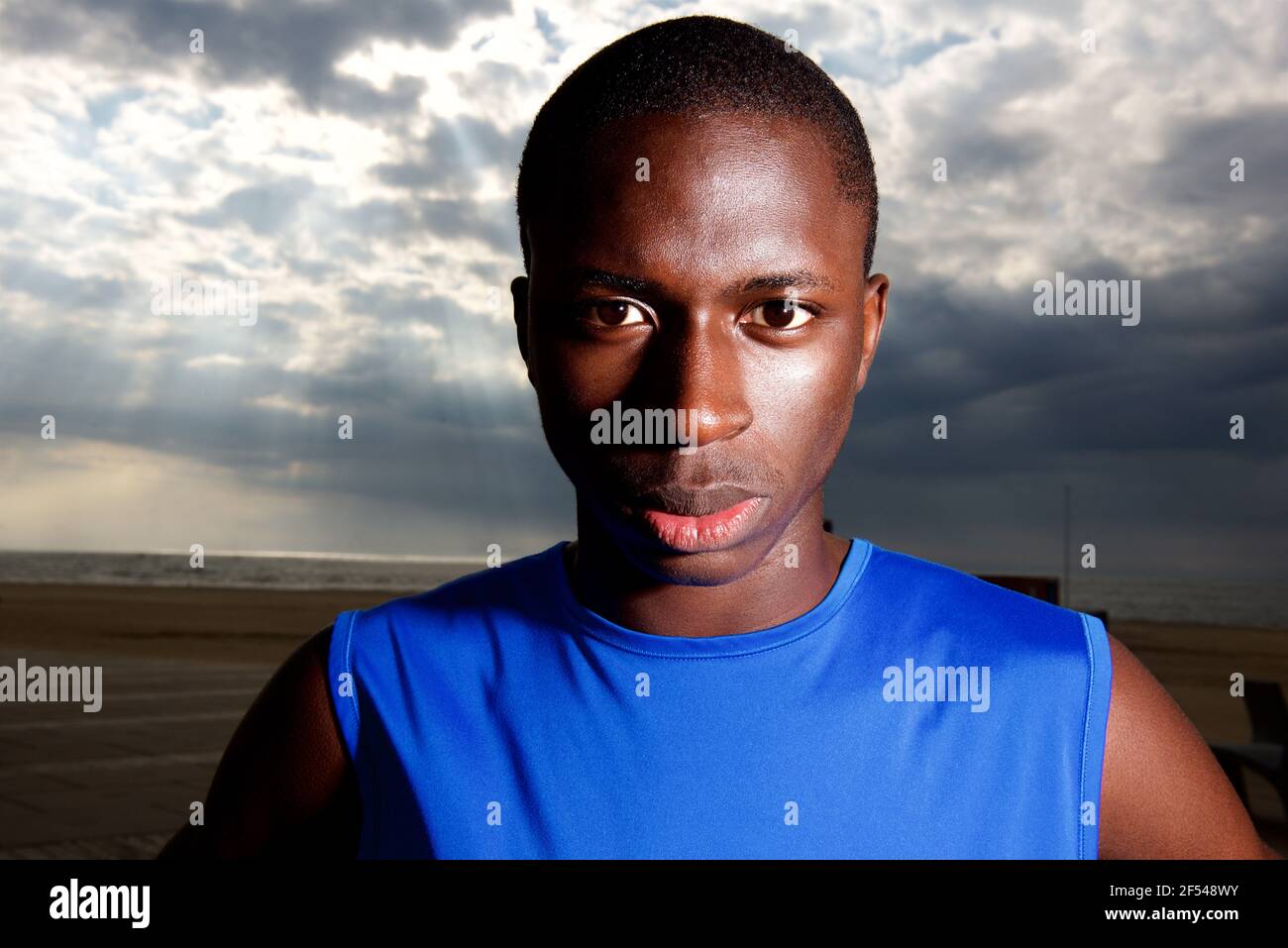 Close up portrait of healthy black guy standing outdoors Stock Photo