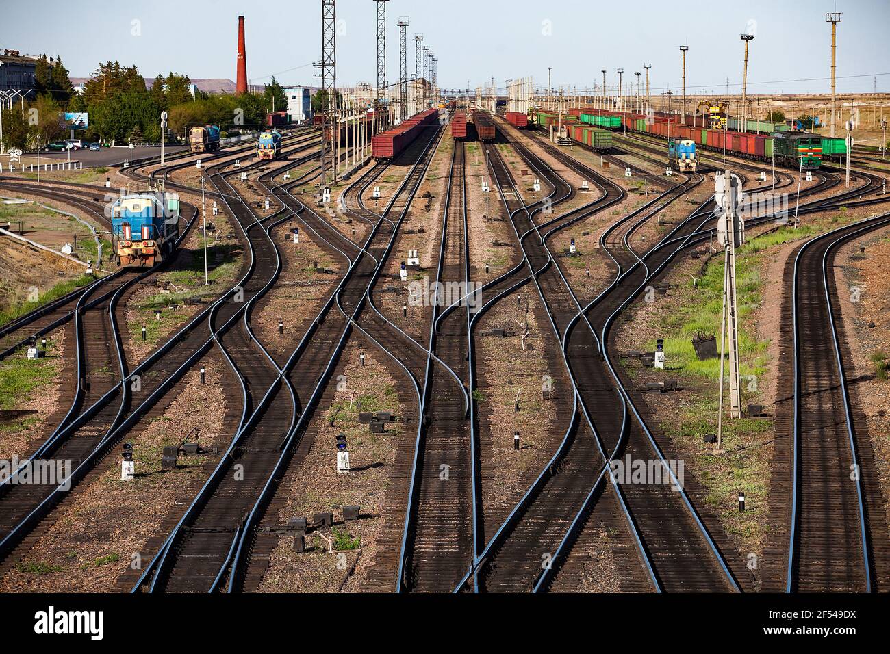 Railway station 'Bogatyr' near coal quarry. Rails and trains panorama. Kazakhstan, Ekibastuz. Stock Photo