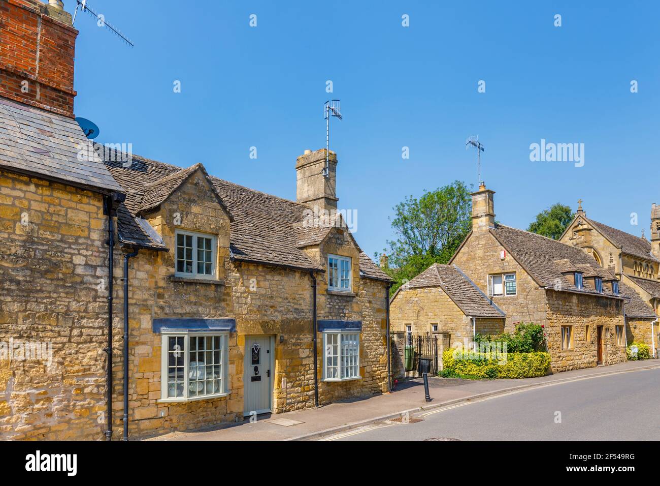 Typical picturesque roadside Cotswold stone slate roof houses in Chipping Campden, a small market town in the Cotswolds in Gloucestershire Stock Photo