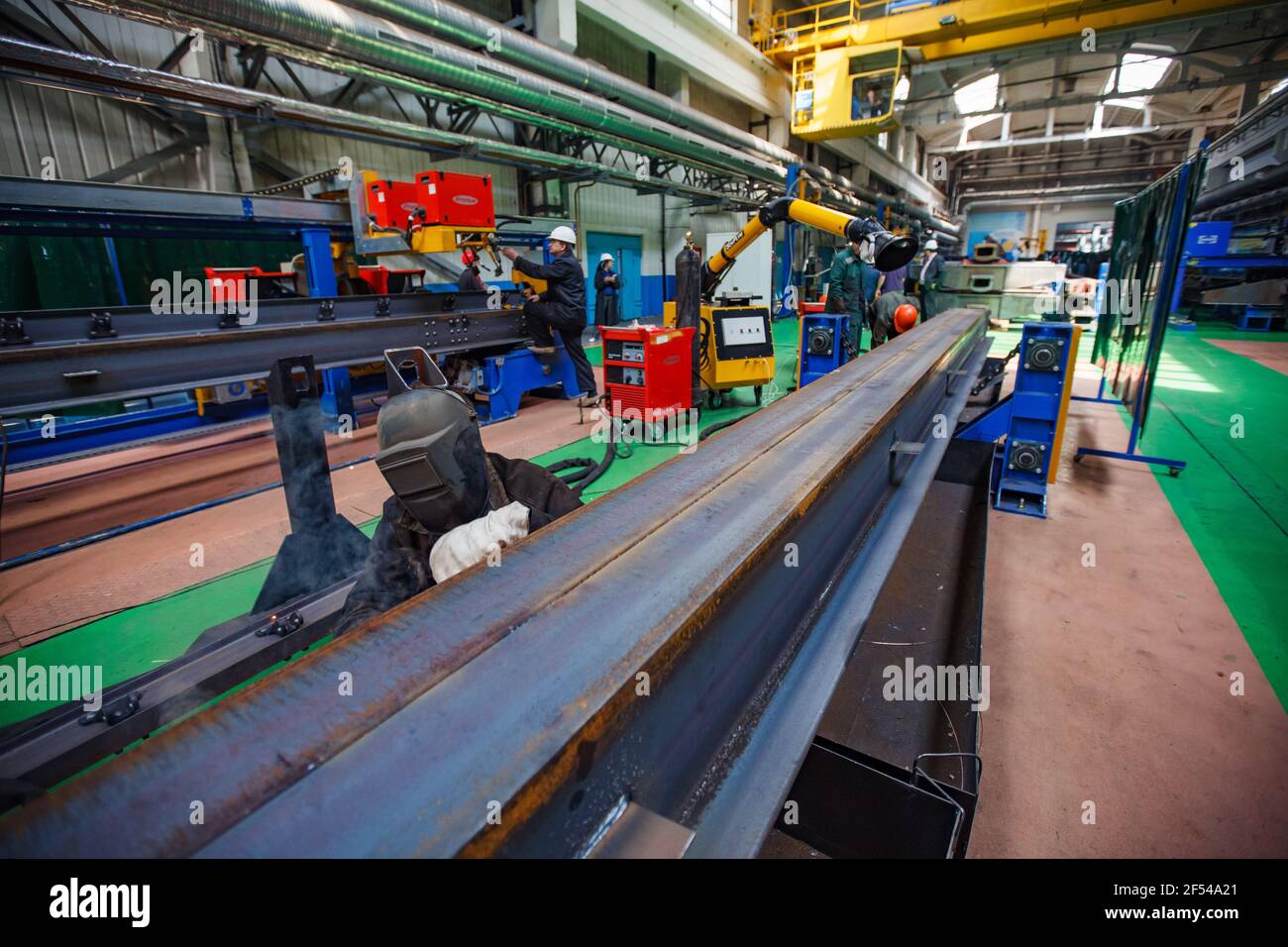 Ekibastuz, Pavlodar region, Kazakhstan: Carriage-building plant. Welding works on large steel part. Stock Photo