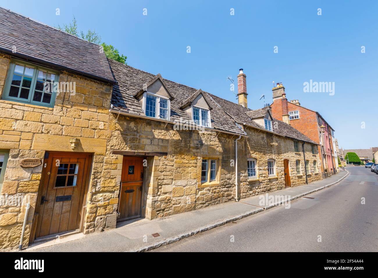 Typical roadside Cotswold stone slate roof houses in Chipping Campden, a small market town in the Cotswolds in Gloucestershire Stock Photo