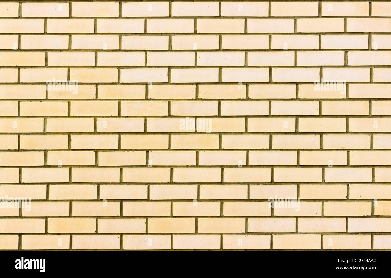Abstract of a light yellow brick wall background Stock Photo