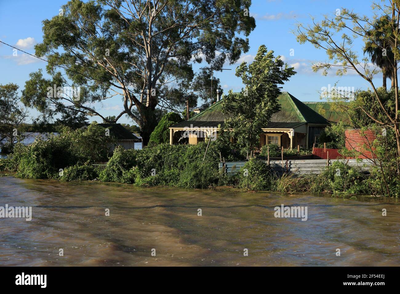 A house surrounded on three sides by floodwaters at McGraths Hill, during the March 2021 Hawkesbury-Nepean River flood, Australia. Stock Photo