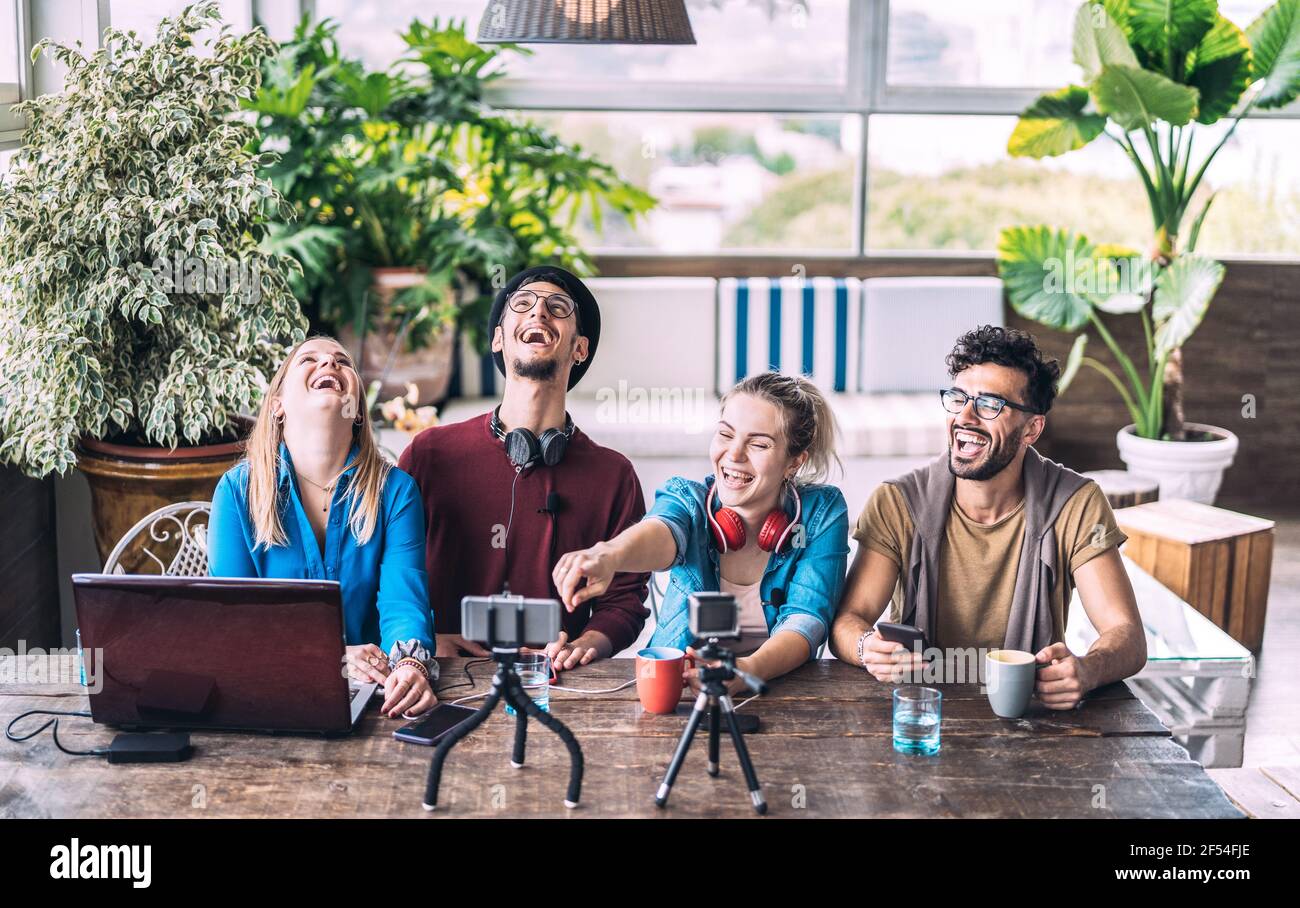 Young millenial friends sharing creative content online - Digital marketing concept with next generation influencer having fun on air Stock Photo
