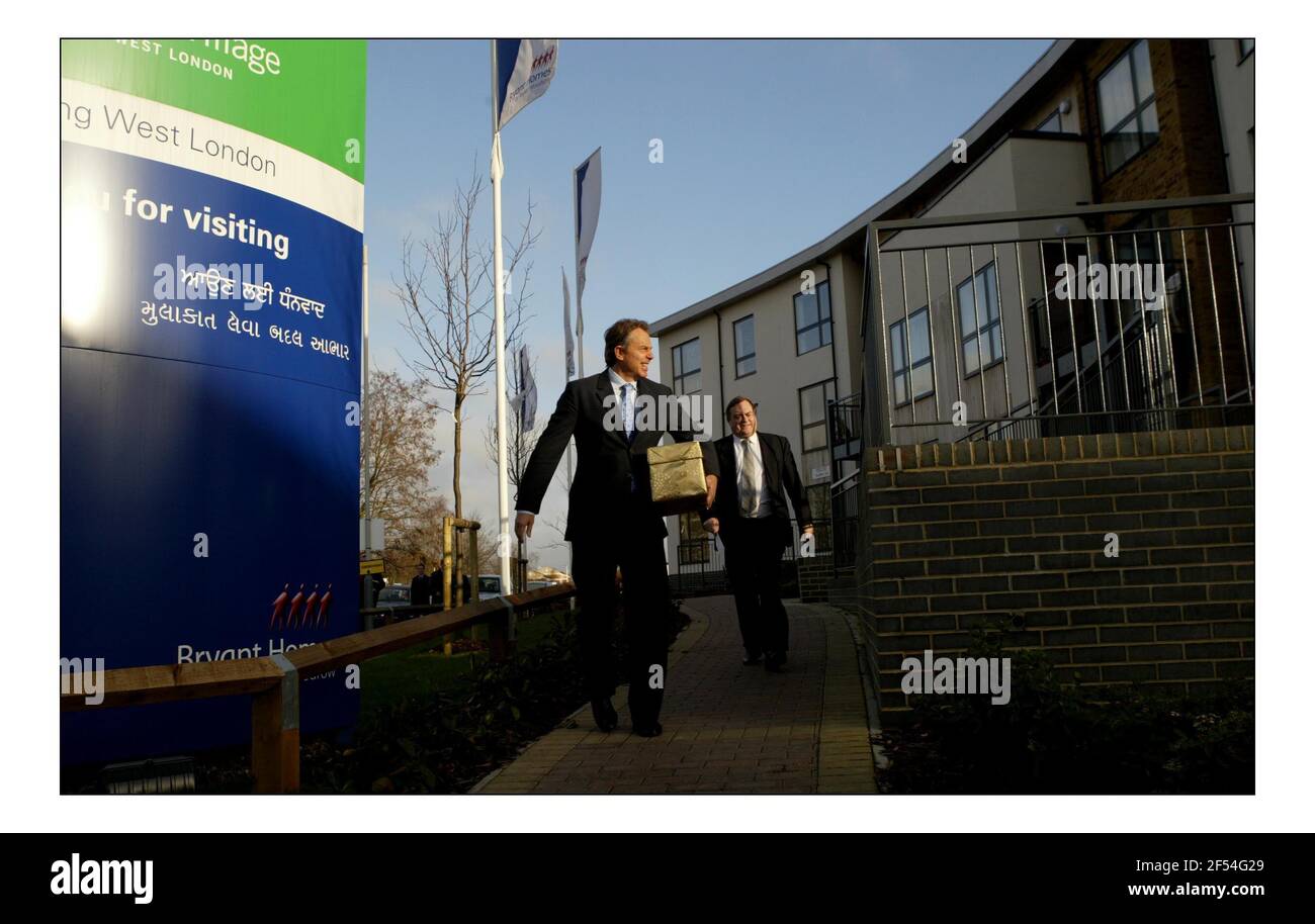 Government unveils 5 yr housing plans......Tony Blair and John Prescott pay a visit to Grand Union Village in Northolt, West London.pic David Sandison 24/1/2005 POOL Stock Photo