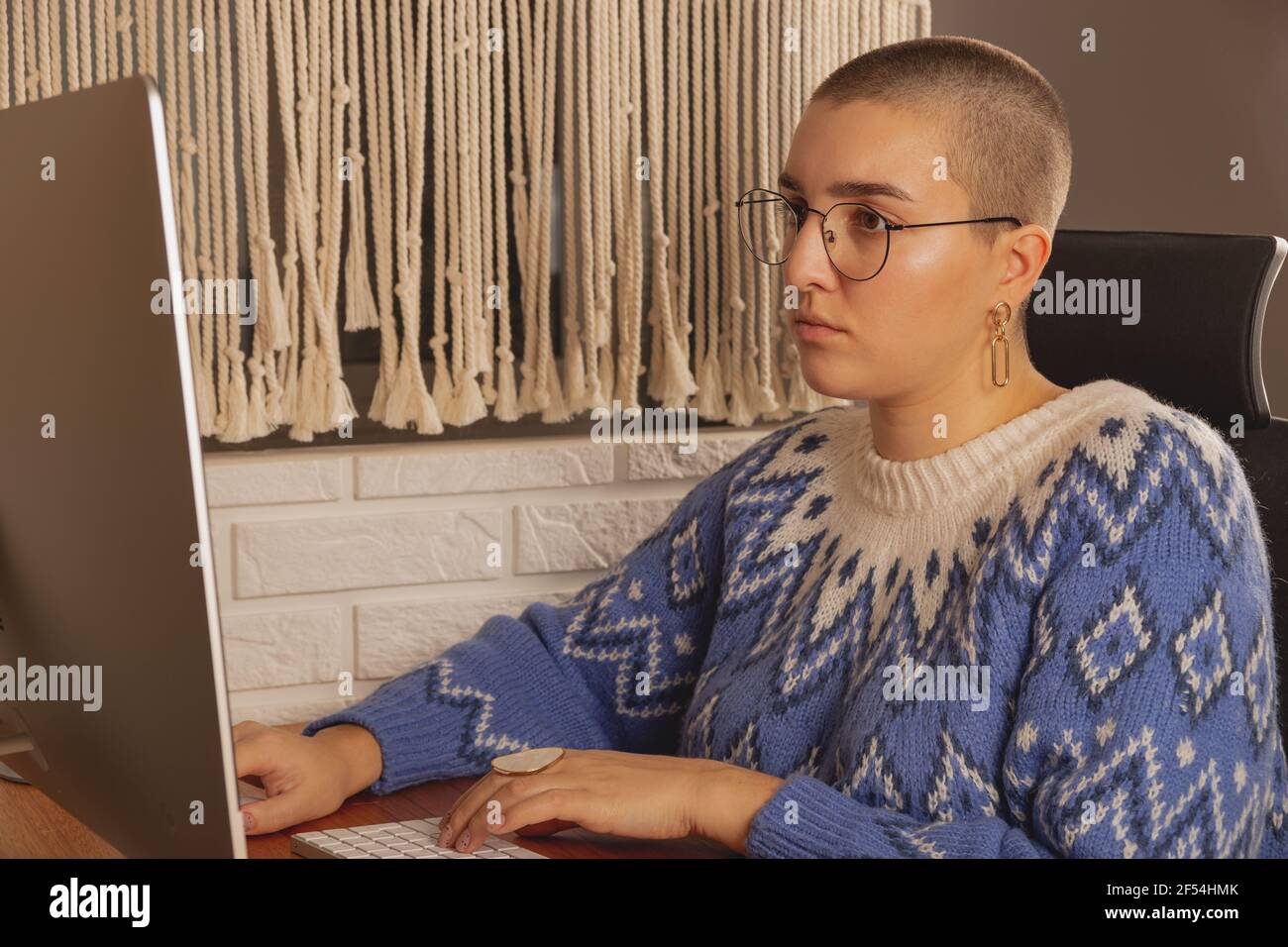 Computer Real Person Check The woman works from home at the computer. Real people during a ...