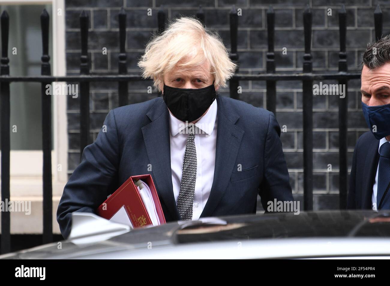 Prime Minister Boris Johnson leaves 10 Downing Street to attend Prime Minister's Questions at the Houses of Parliament. Picture date: Wednesday March 24, 2021. Stock Photo