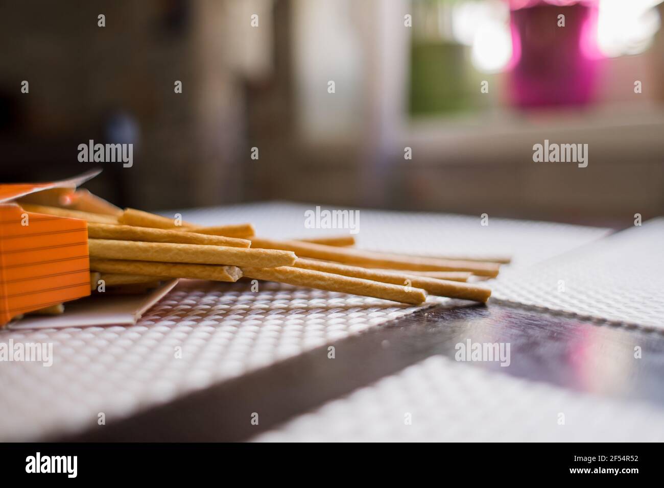 a long crispy straws on the kitchen table Stock Photo
