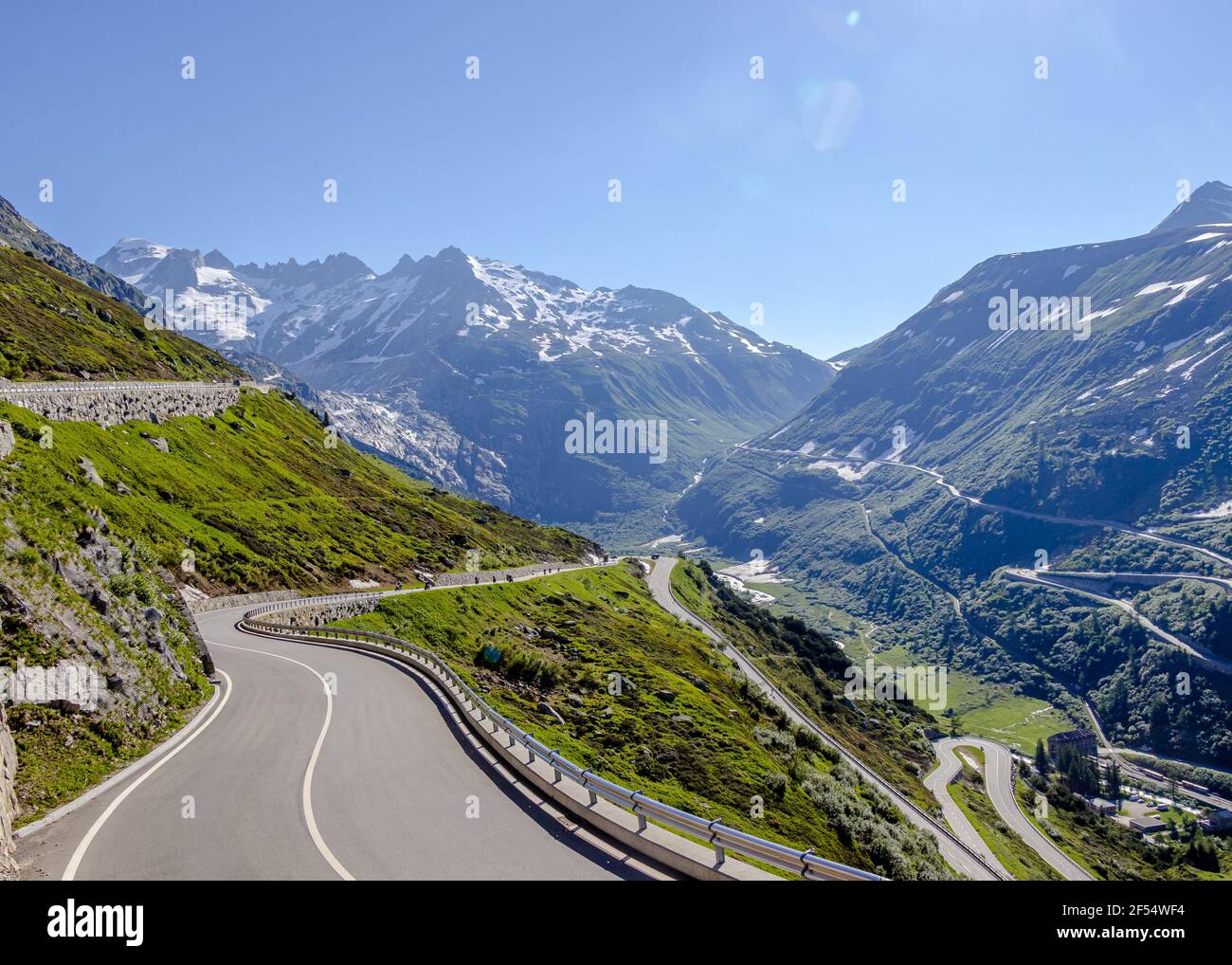 Majestic alpine scene with an empty paved Grimsel mountain Pass in ...