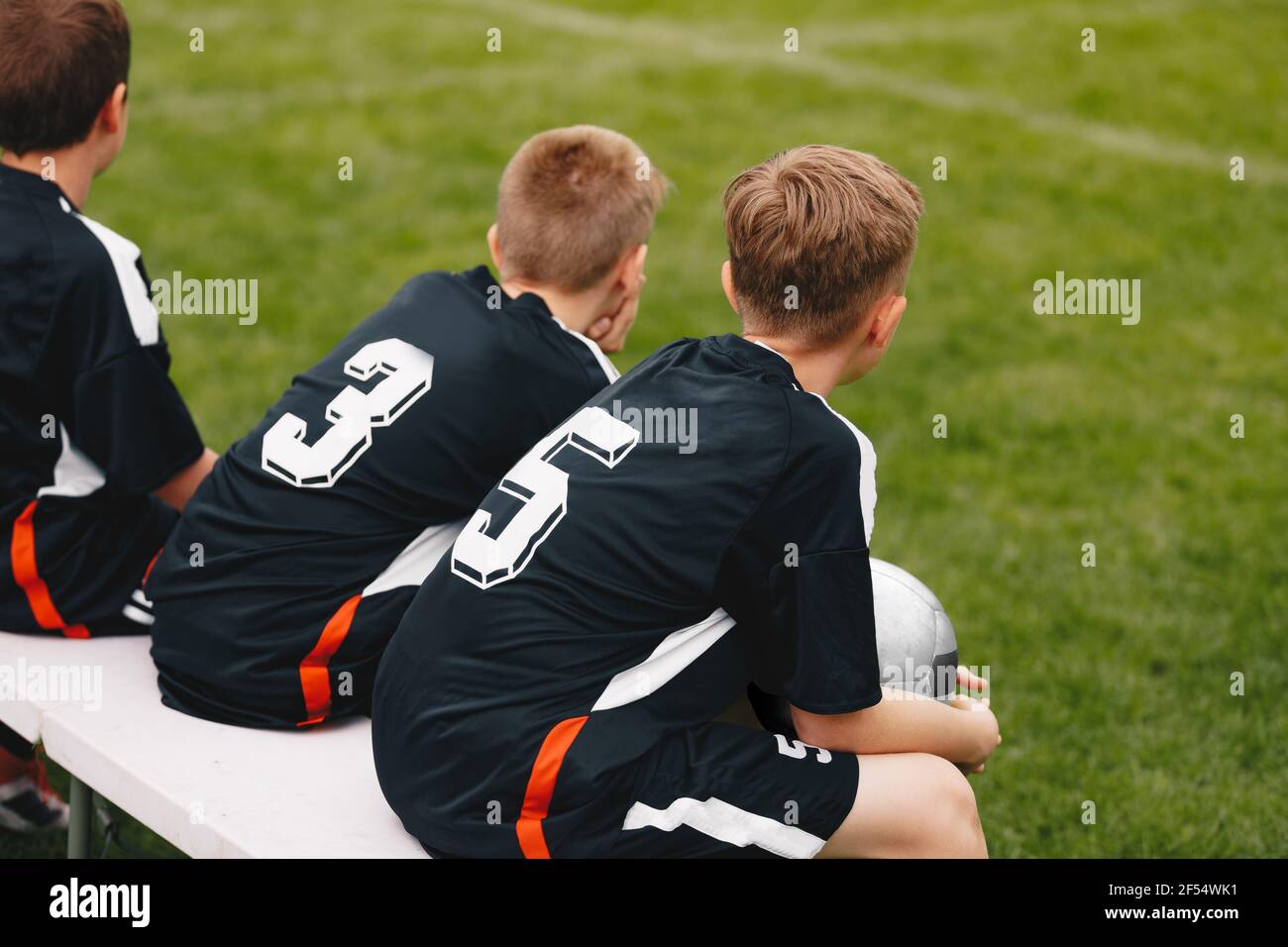 Young School Boys in a Sports Team Sitting on Substitute Bench. Kids on