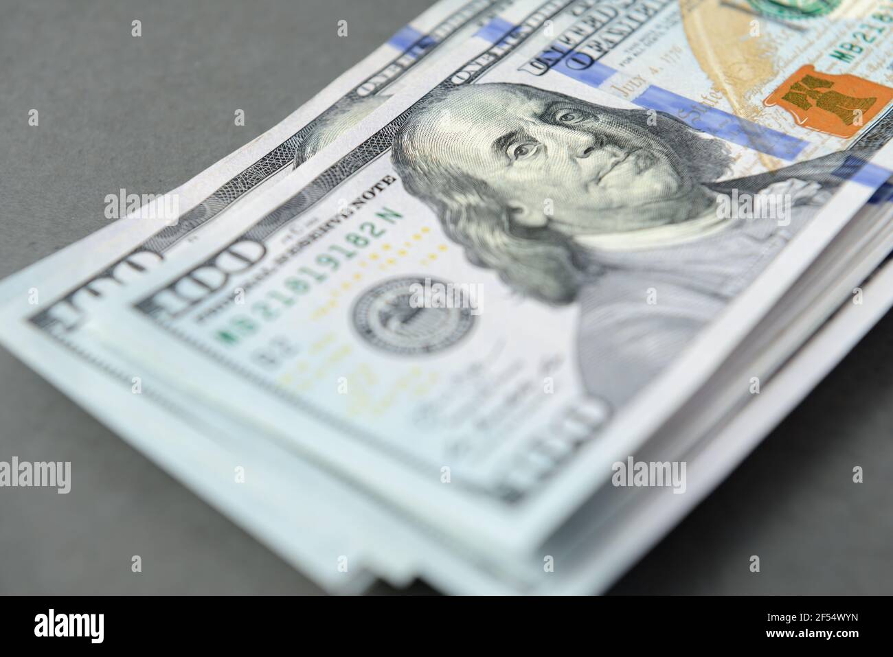 Pile of one hundred dollar banknotes as money background. New dollar bills spread in financial concept Stock Photo