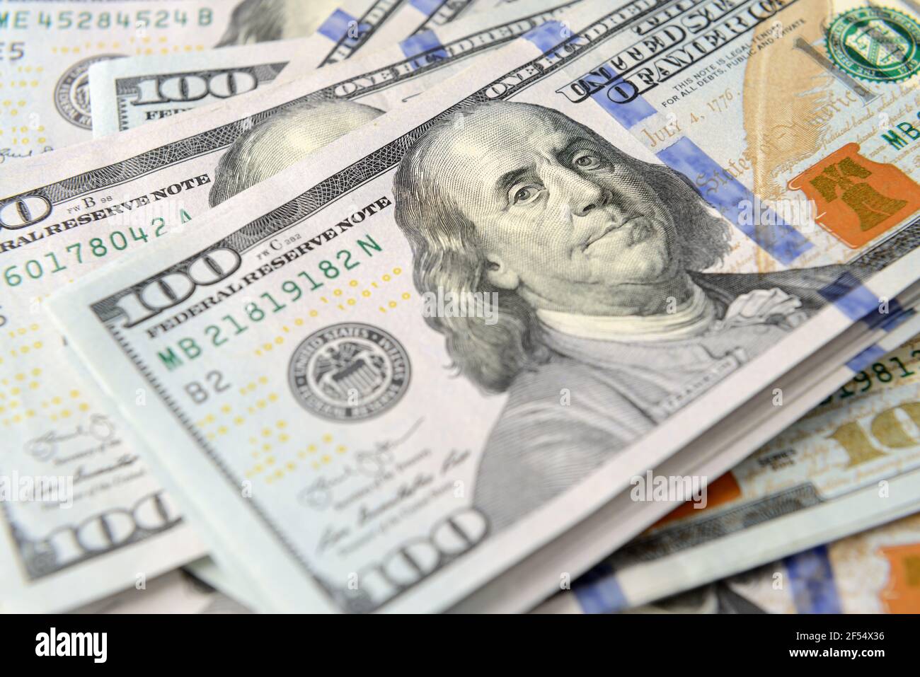 Pile of one hundred dollar banknotes as money background. New dollar bills spread in financial concept Stock Photo