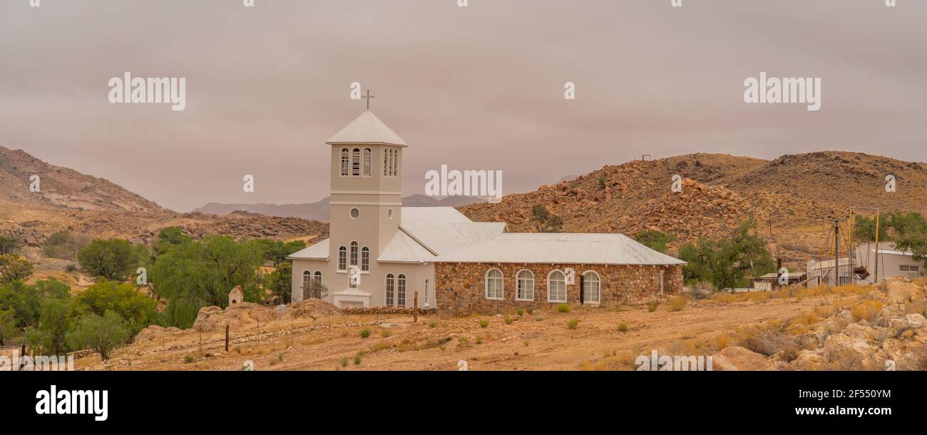 White Church from Town Aus, Namibia, background cloudy sky, Namib Naukluft Rand Stock Photo