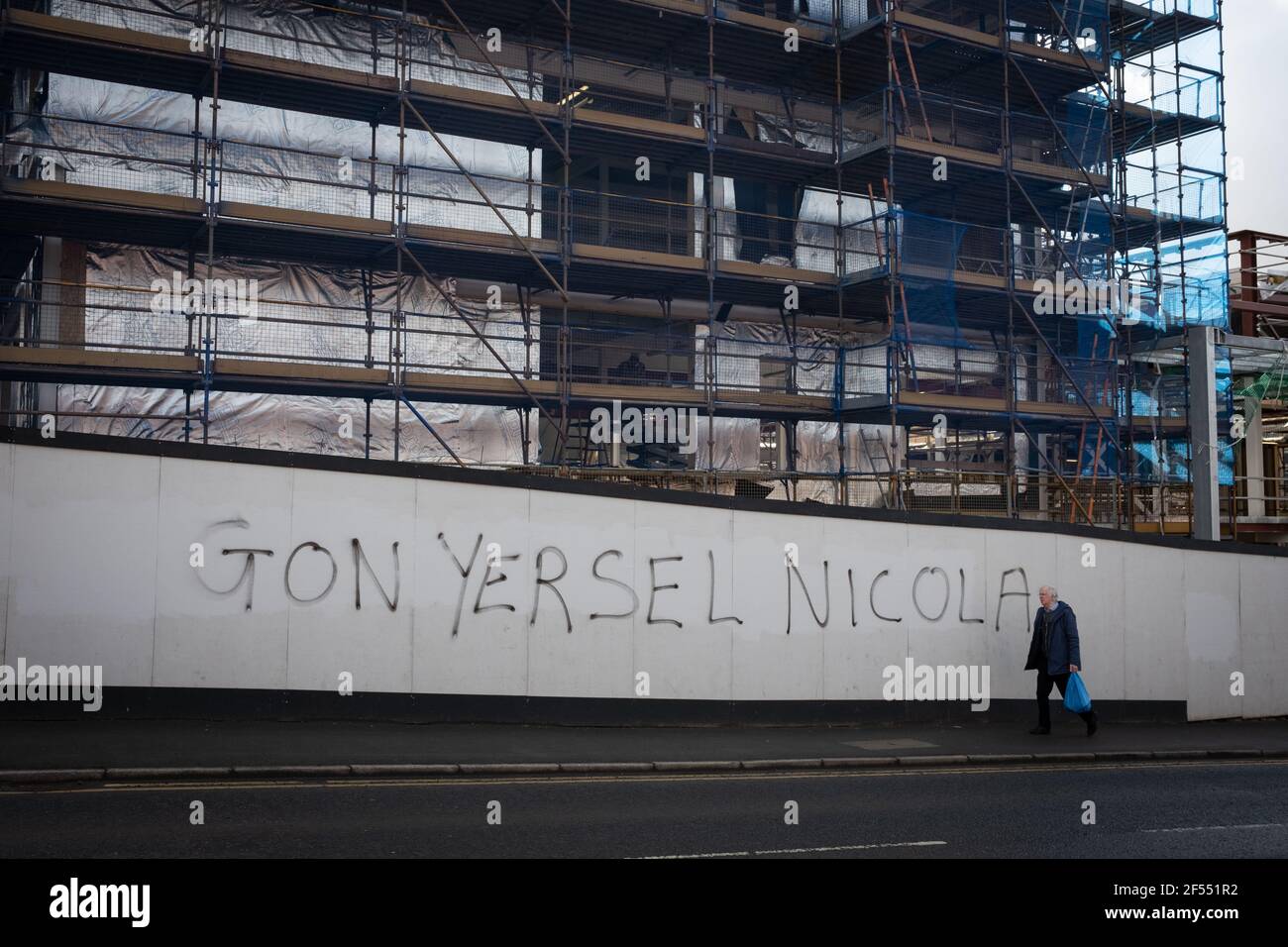 Glasgow, UK, on 24 March 2021. ÔGon yersel NicolaÕ graffiti appears in support of First Minister Nicola Sturgeon, on a building site wall, as the Scottish political parties begin their campaigning for the 6th May elections to the Scottish Parliament. Photo credit: Jeremy Sutton-Hibbert/Alamy Live News. Stock Photo