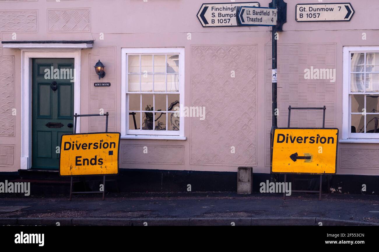 Road signs including diversion and diversion ends a short distance apart with finger boards to various places including Gt. Dunmow and Finchingfield Stock Photo