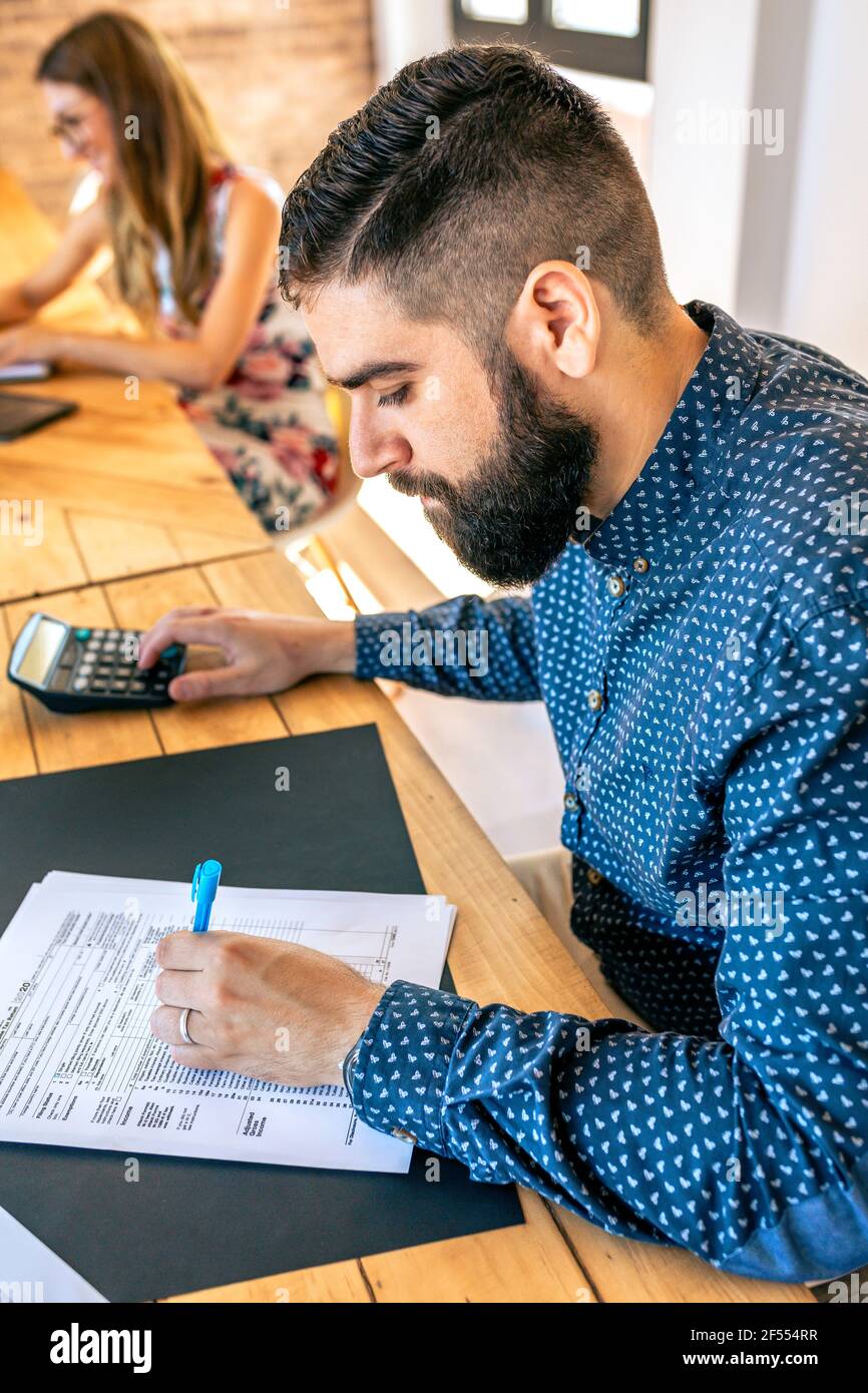Man filling his tax form hi-res stock photography and images - Alamy