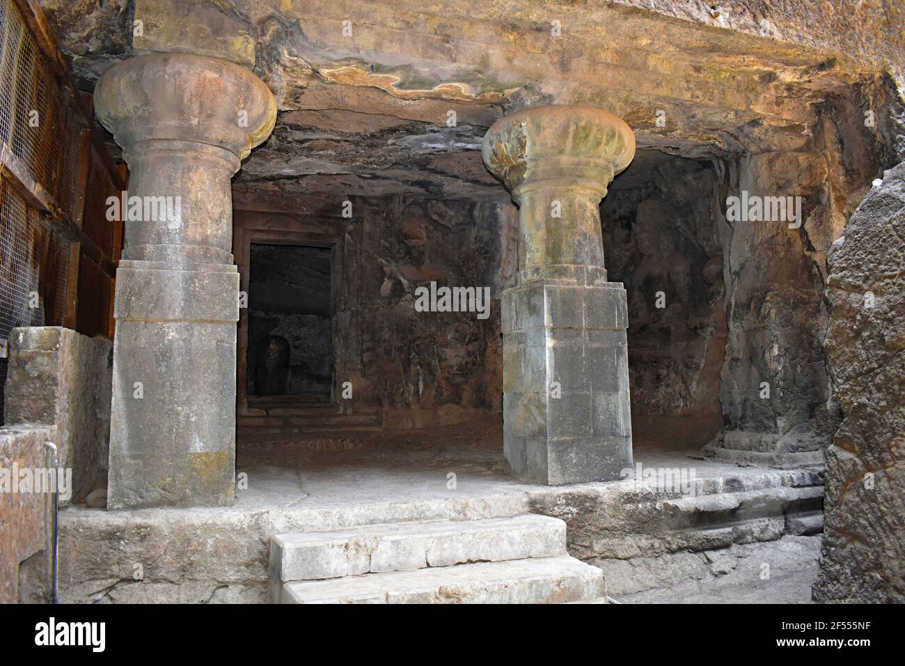 Gigantic pillars of Cave No. 1, Elephanta Cave, entrance towards Shiva Linga at Elephanta Island or Gharapuri, Mumbai, Maharashtra, India Stock Photo